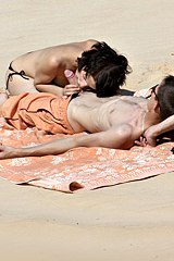 A hot couple is having sex on the beach